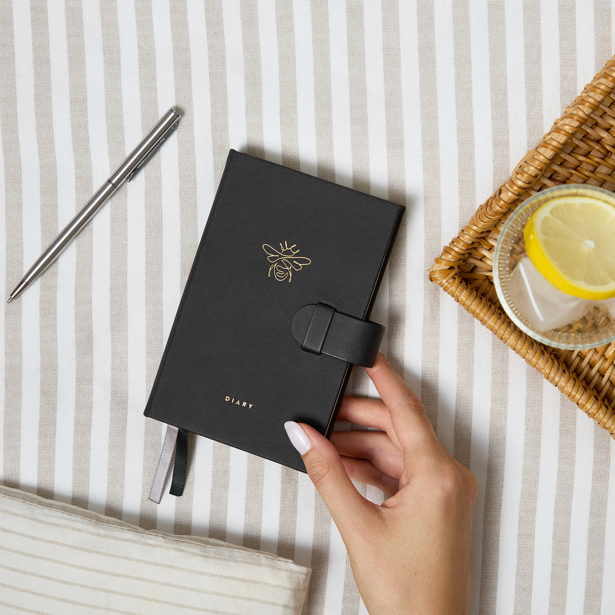 2027 Pocket Diary | Gold Bee styled flat lay with a pen